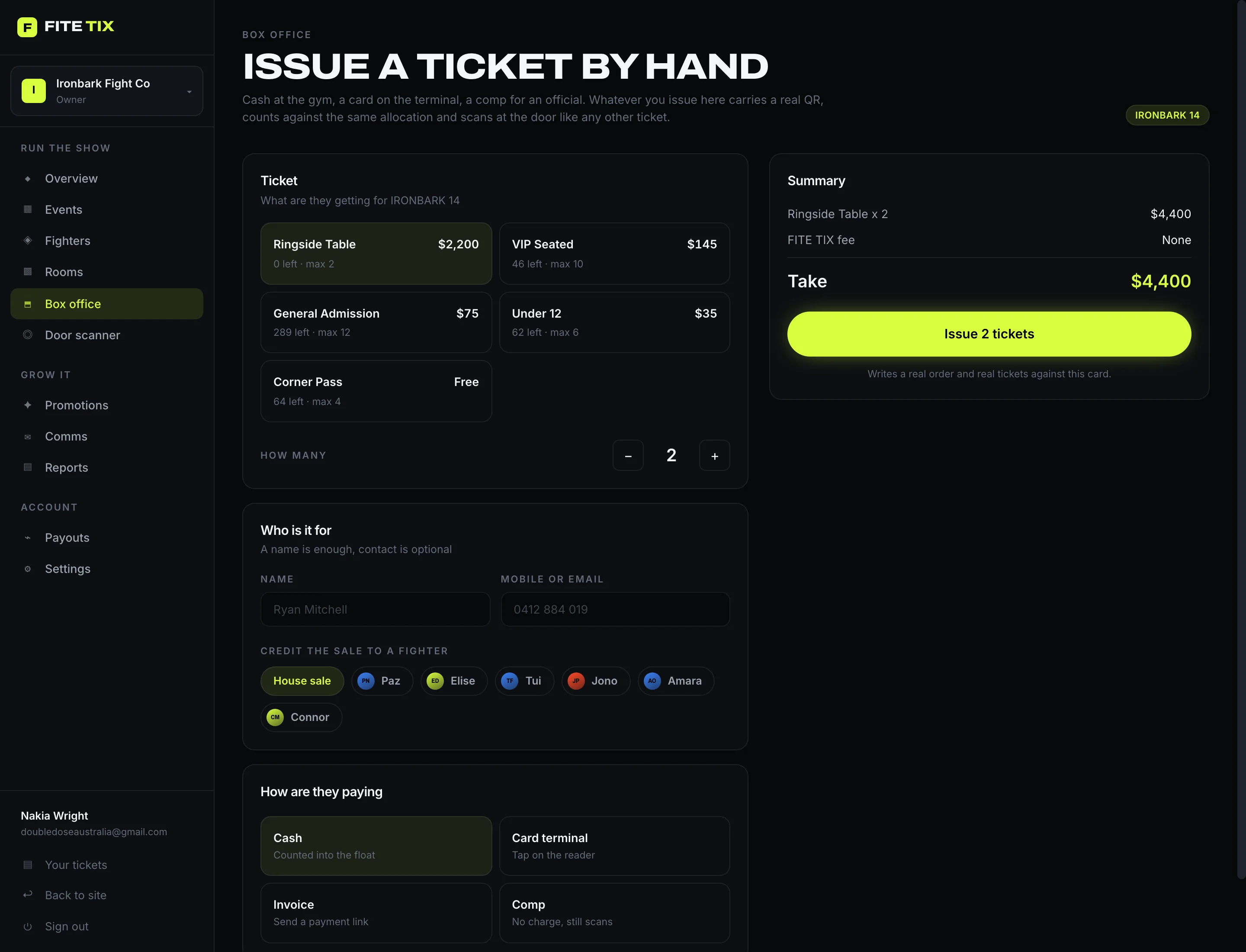 The box office screen issuing a ticket by hand